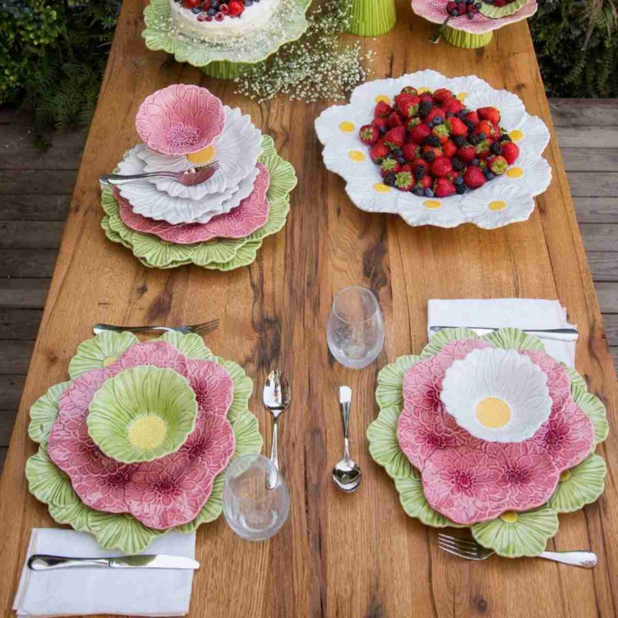 Bordallo Maria Flor Plate range on a wooden table with fruit salad.