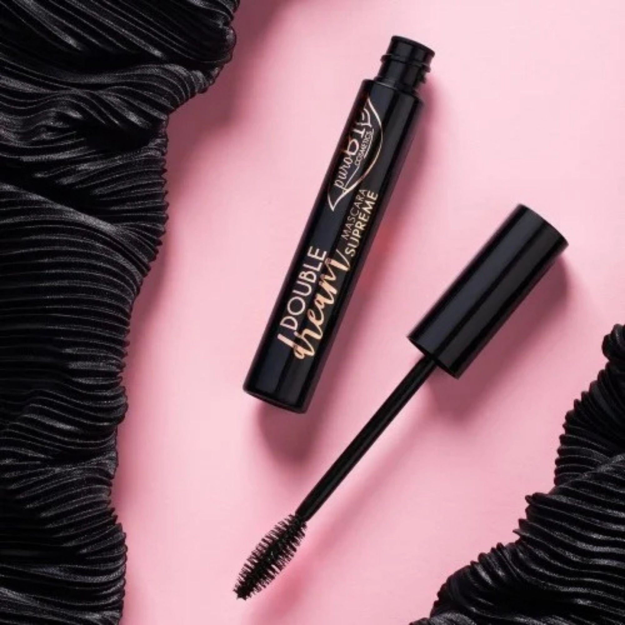 PuroBIO Mascara Double Dream Supreme Black open cap on a pink background