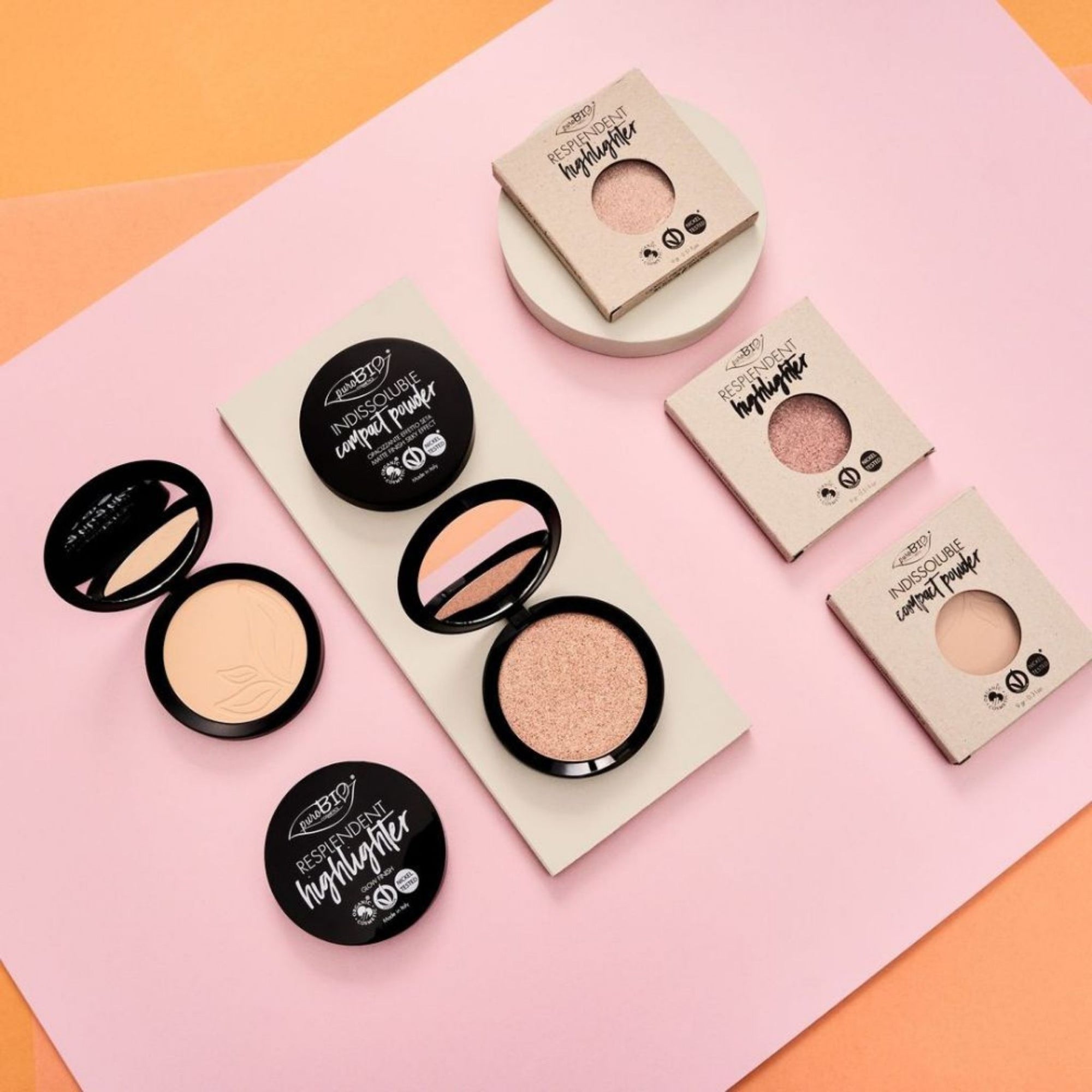 PuroBIO Resplendent Compact Highlighter Refills on a pink and orange background