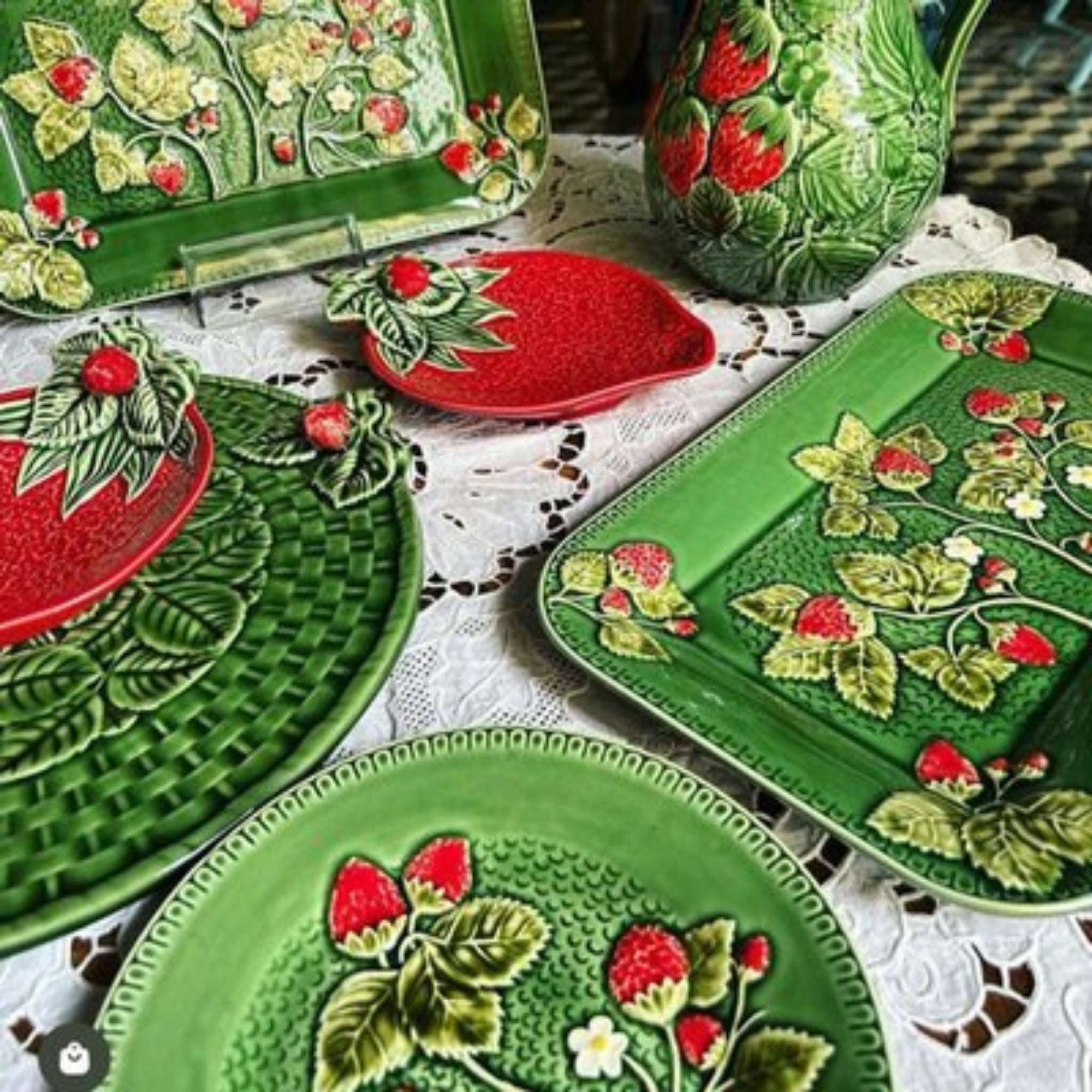 Bordallo Strawberries Cheese Tray on a white lace tablecloth.